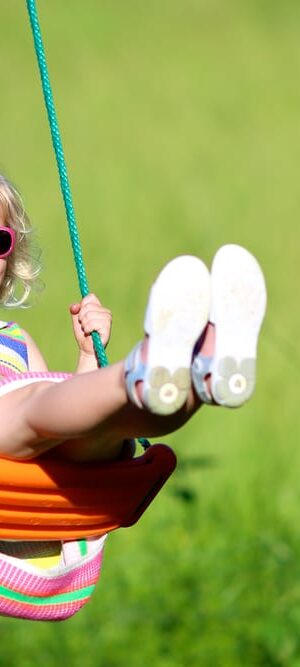 girl outdoors on swing