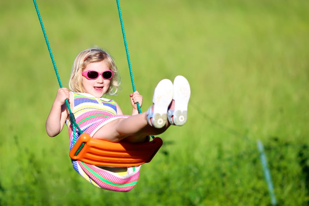 girl outdoors on swing