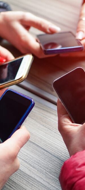 group of teens with phones