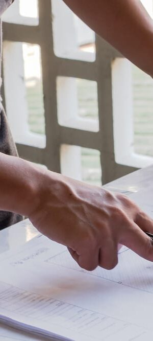 hand pointing on construction papers