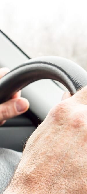 hands on a steering wheel