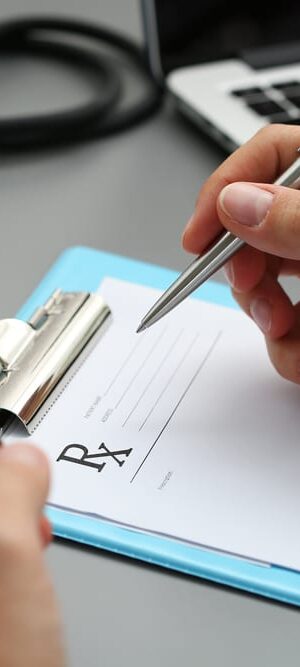 hands with prescription pad