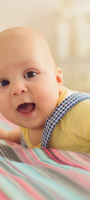 happy baby on bed