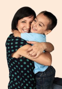 photo of little boy hugging mom