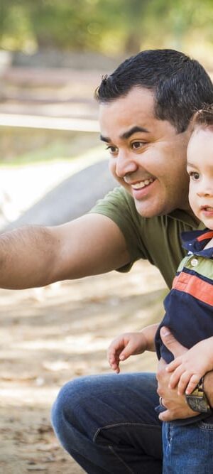 little boy with dad at park