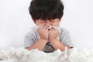 photo of boy with tissues