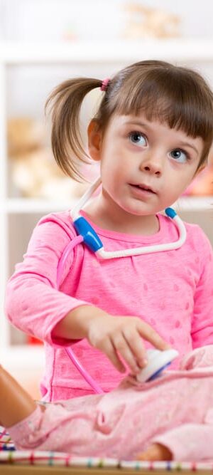 little girl with doll