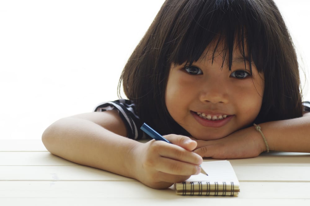 Little Girl With Notebook - Wyoming Department Of Health