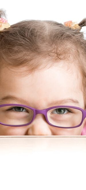 little girl with purple glasses