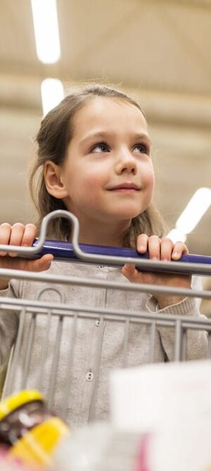 little girl with shopping cart