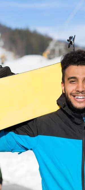 man outdoors with snowboard