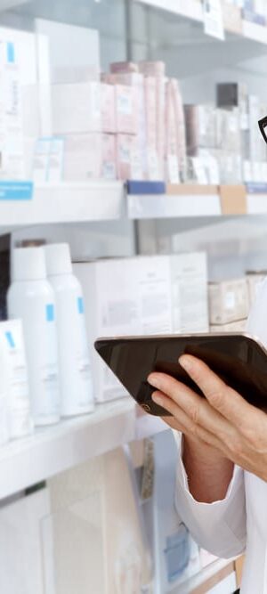 man using table in pharmacy
