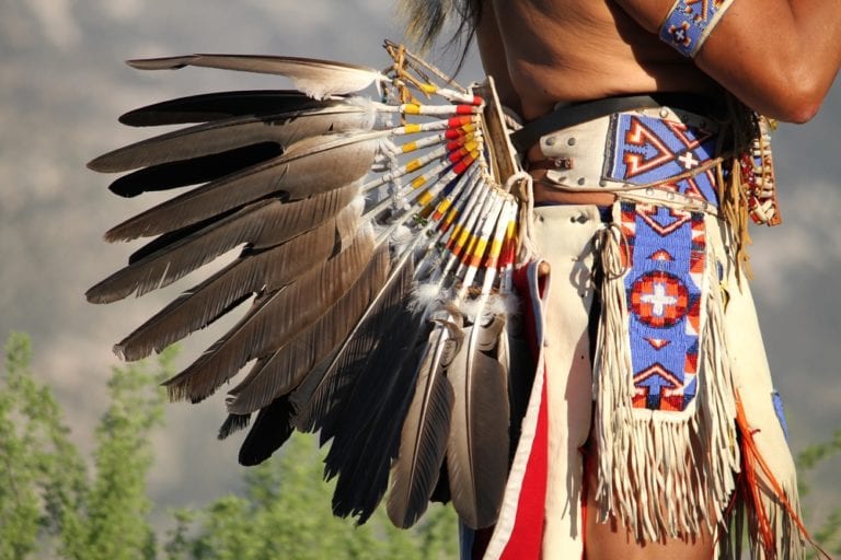 man wearing eagle feathers Wyoming Department of Health man wearing eagle feathers Wyoming Department of Health