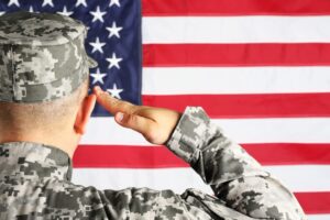military guy saluting flag