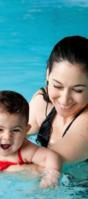 mom and baby girl in pool