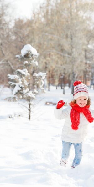mom and girl walking in snow