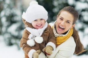 photo of mom and toddler in the snow