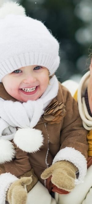 mom and toddler in snow