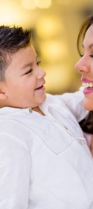 mom hugging little boy