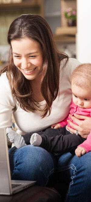 mom with baby and computer