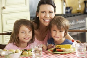 photo of mom with kids at table
