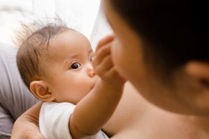 Newborn baby breastfeeding