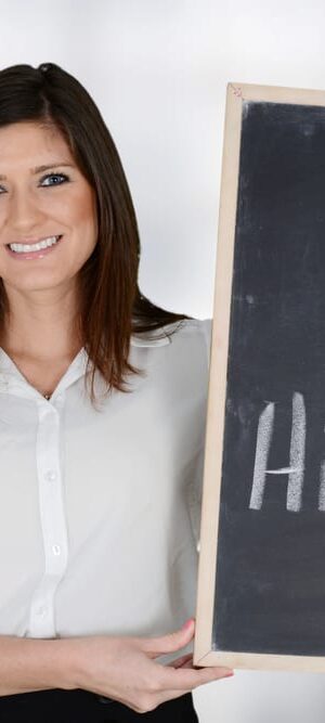 now hiring on chalkboard with woman