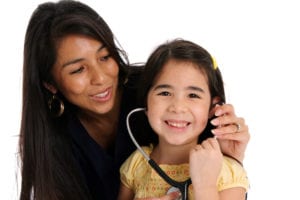 Photo of nurse and young girl patient