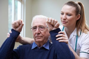 older man in physical therapy