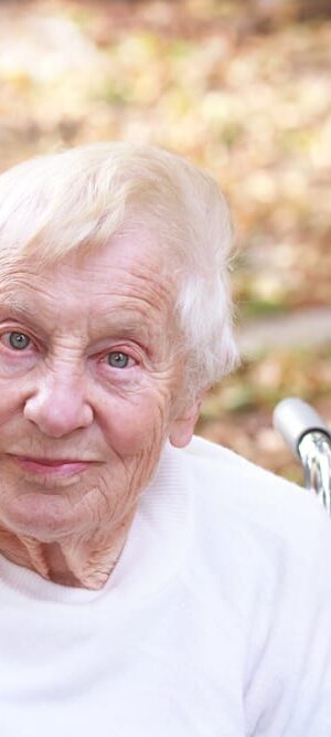 older woman outdoors in wheelchair