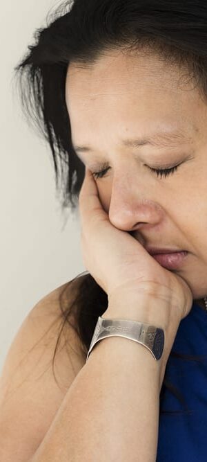 sad woman with eyes closed