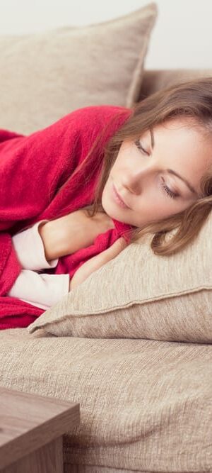 sick woman on couch
