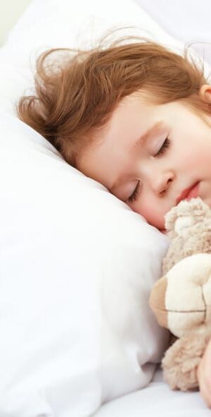 sleeping girl with bear