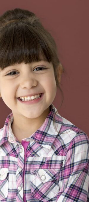 smiling girl with pink shirt