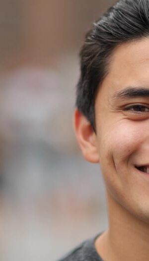 smiling man with blurred background