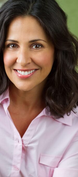 smiling woman in pink shirt