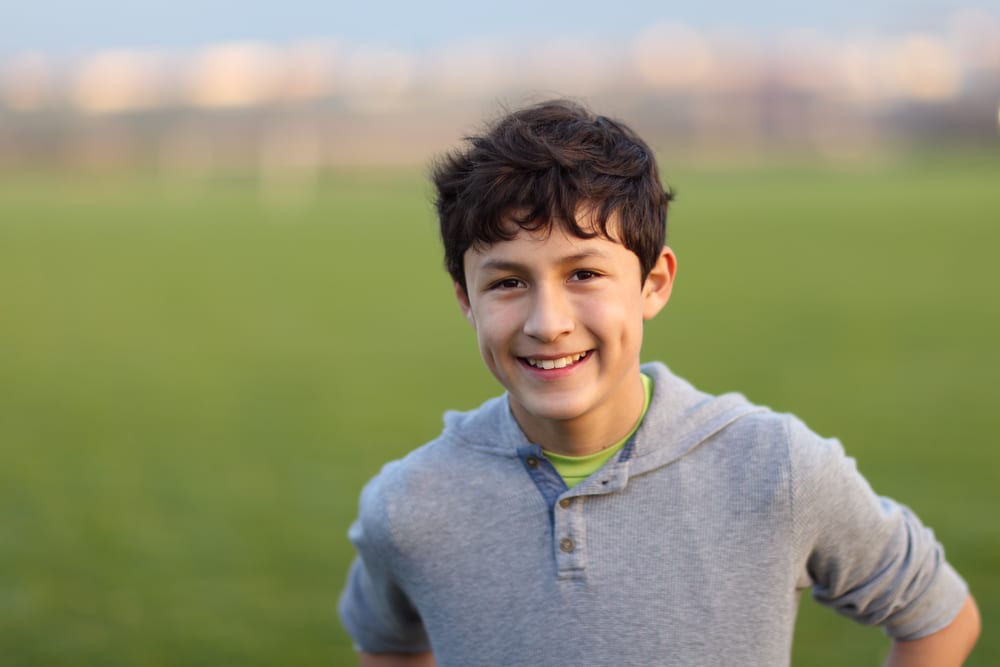 teen boy on sports field