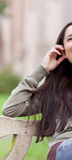 teen girl on phone outdoors