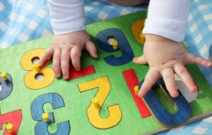 photo of toddler hands with numbers