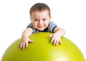 toddler with giant ball