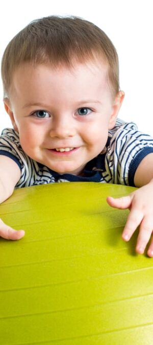 toddler with giant ball