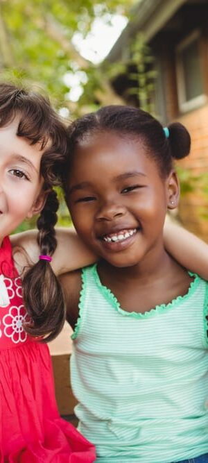 two girls by building outdoors