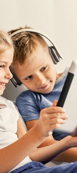 two kids using a tablet
