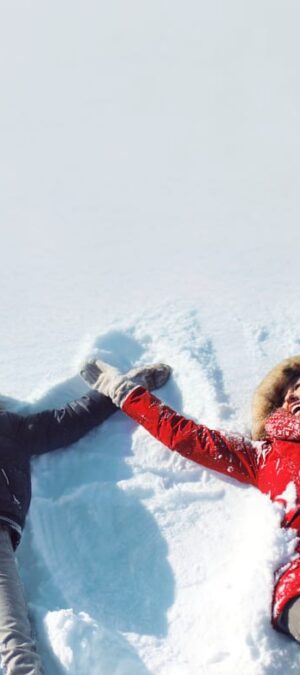 two people making snow angels