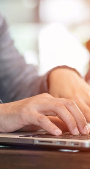 typing on laptop close up