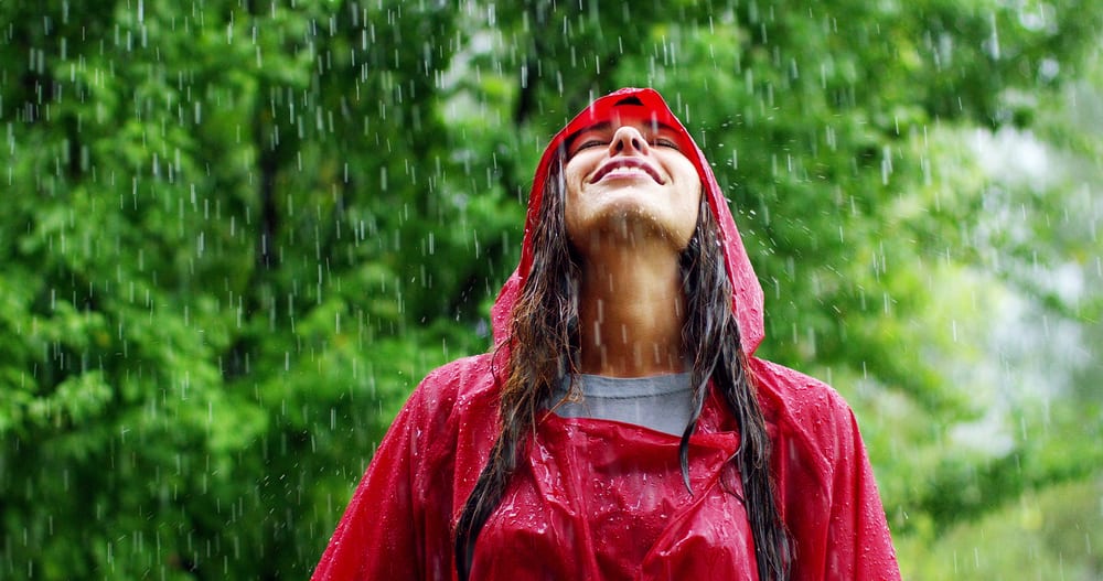 woman outdoors in rain - Wyoming Department of Health