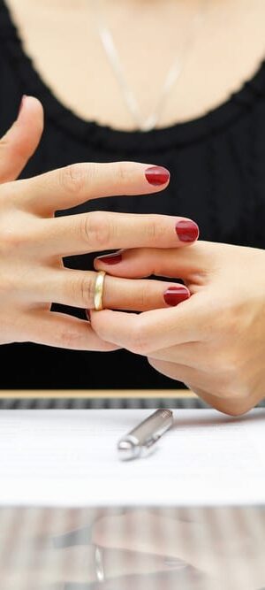 woman taking off ring