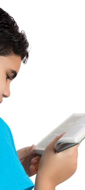 young boy reading a book
