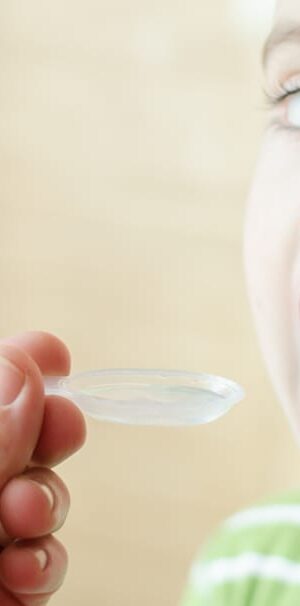 young boy taking medicine