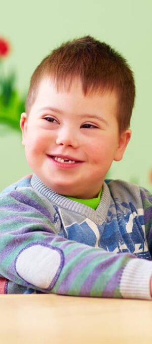 young disabled boy with toy